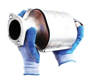 Heat Resistant Gloves holding hot motor part